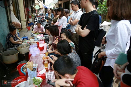Enjoying fish noodles in Hanoi