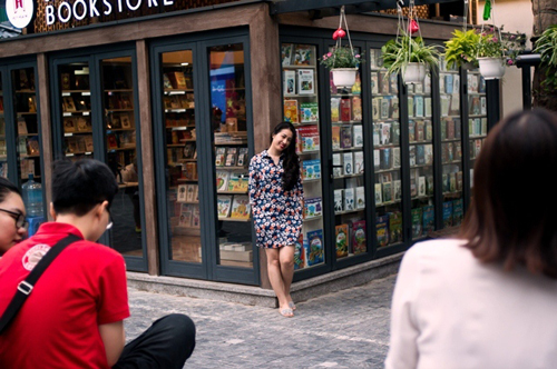 Visitors taking photos outside of a bookstore