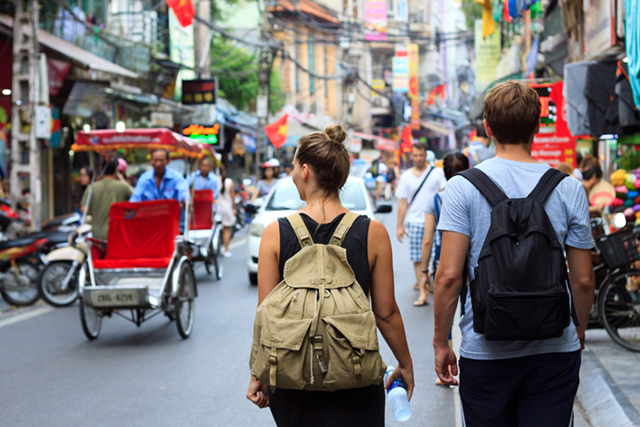 A couple wandering around Hanoi's Old Quarter