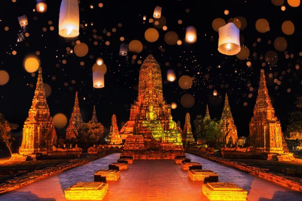 Lanterns light up the night sky during Loy Krathong in Ayutthaya Historical Park.