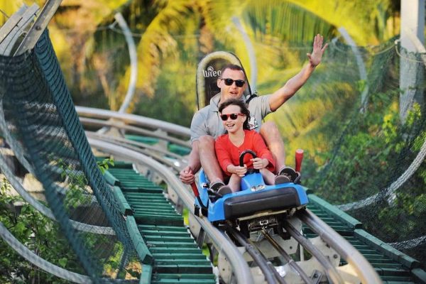 A man and his son share ride on the Ba Na Hills Alpine Coaster.