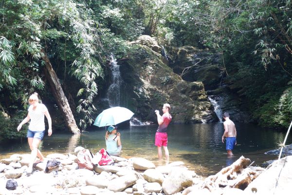 Tourist taking photos and soaking in the water of the Five Lakes.