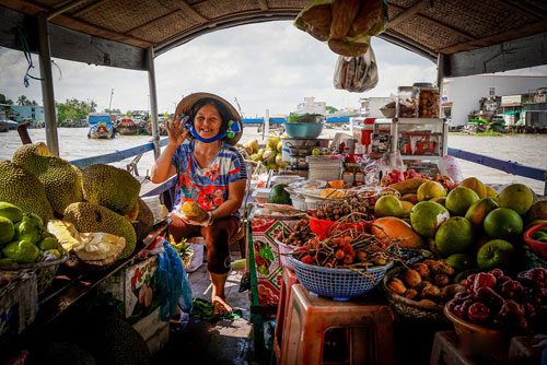 A shop on a boat on the Mekong River - Legends of Vietnam tour