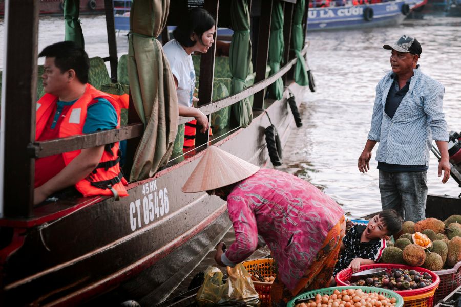 Mekong Delta floating market is a popular destination on across Vietnam tours
