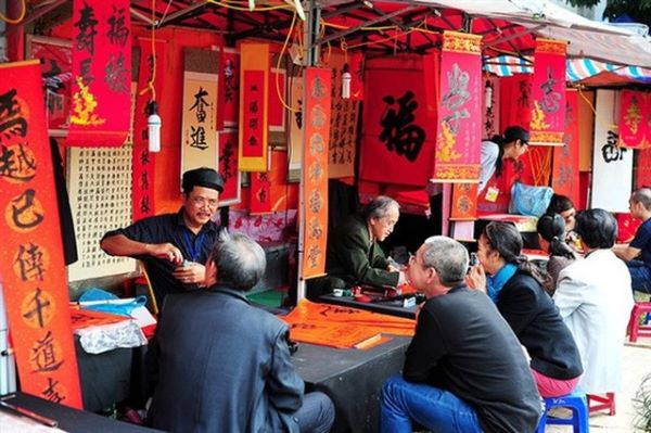 People ask for calligraphy at the Temple of Literature, Vietnam