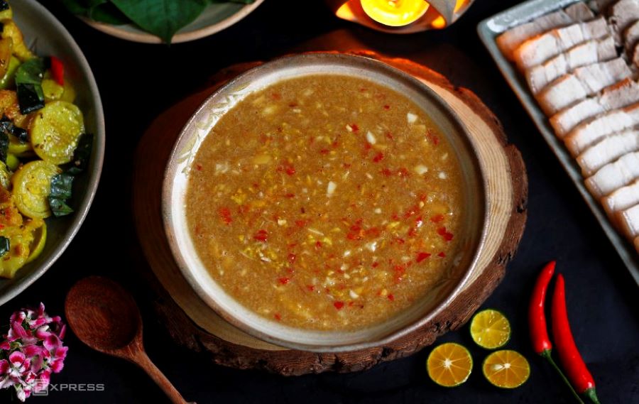 Chili garlic fish sauce dip with sliced pork and zucchini.