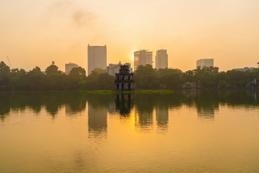 This is the Turtle Tower, Restored Sword Lake, Hanoi - The city you will spend the first night for the Discover Vietnam – Country of Dragons Tour in 17 Days