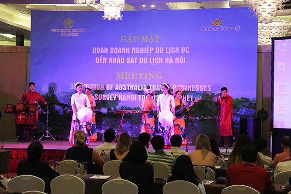 Vietnamese Artists from Thang Long Water Puppet Theatre playing classical musical instruments in a performance of the Ao Dai