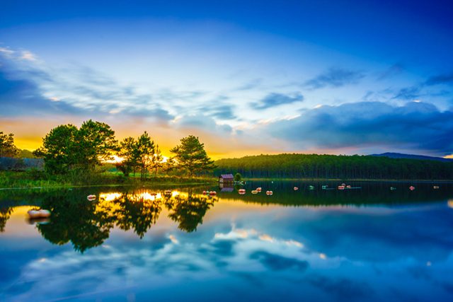 Kayaking along clear water at Tuyen Lam lake