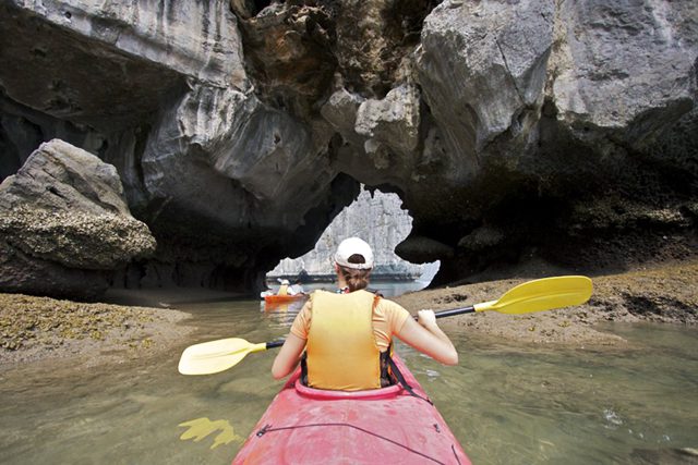 Kayaking in Halong Bay, Vietnam - an ideal activity to take your boat out of the caves' complex maze and through strong waves