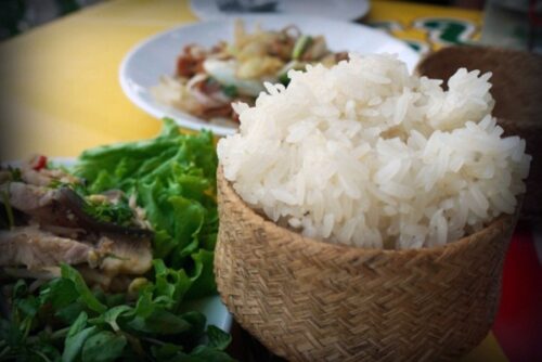 Traditional Khao Niaw (sticky rice) eaten with Laap.