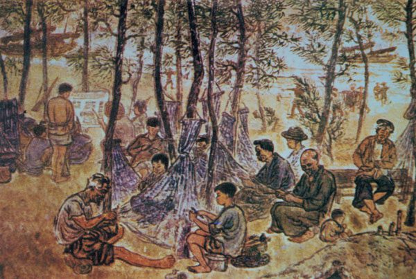 Mending nets at the beach (Woodcarving) by Nguyen Trong Hop