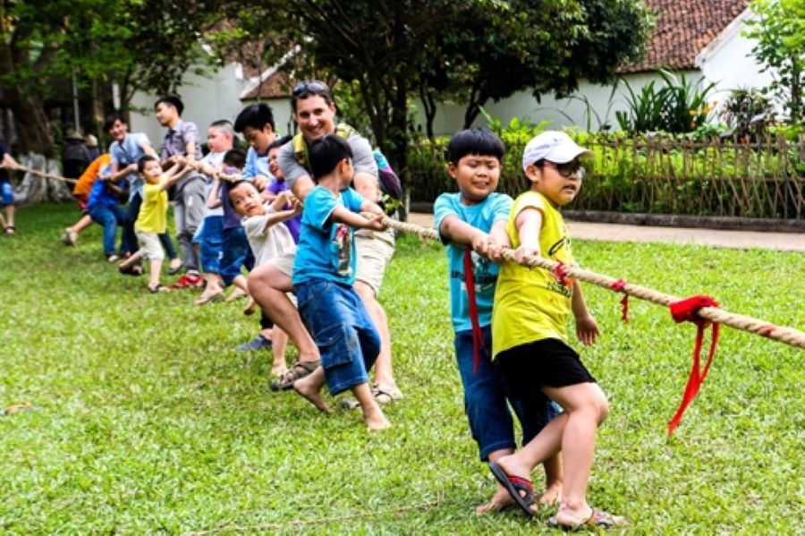 Tug of war game at Vietnam Museum of Ethnology during cultural activity event