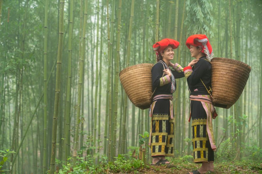 Red Dao in Sapa traditional clothing with red scarf hat.