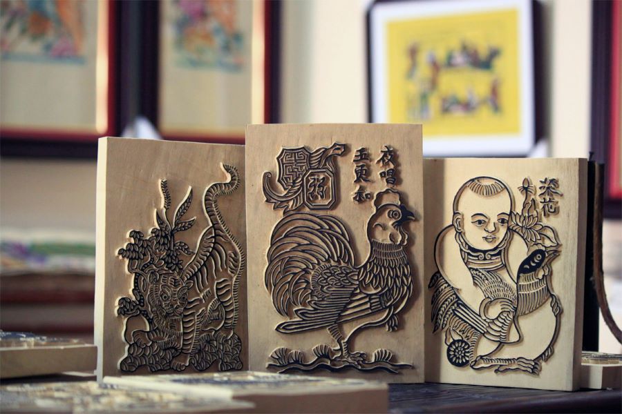 Charming Vietnam souvenirs reflect tradition through vibrant Vietnam folk paintings’ influence