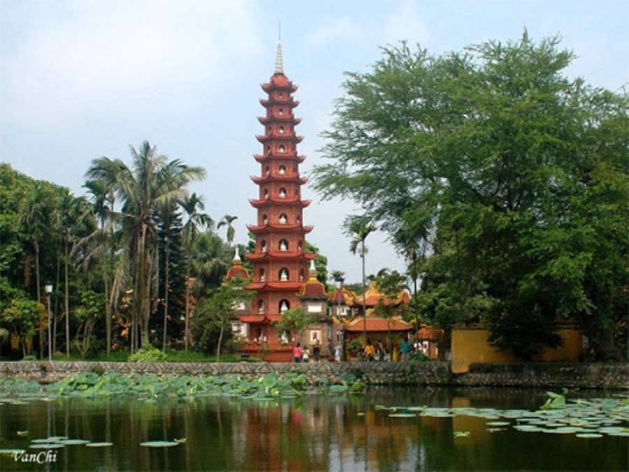 Tran Quoc Pagoda's ancient stupa overlooks lotus ponds, inviting reflection, peace, wonder