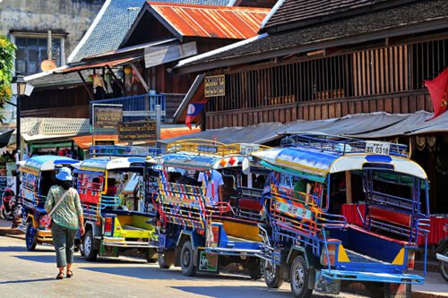 Tuk-tuk's lined up waiting for passengers in Laos