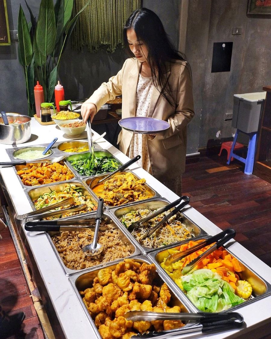 At Veggie Castle vegan restaurant Hanoi, diners enjoy picking fresh, flavorful vegan meals.